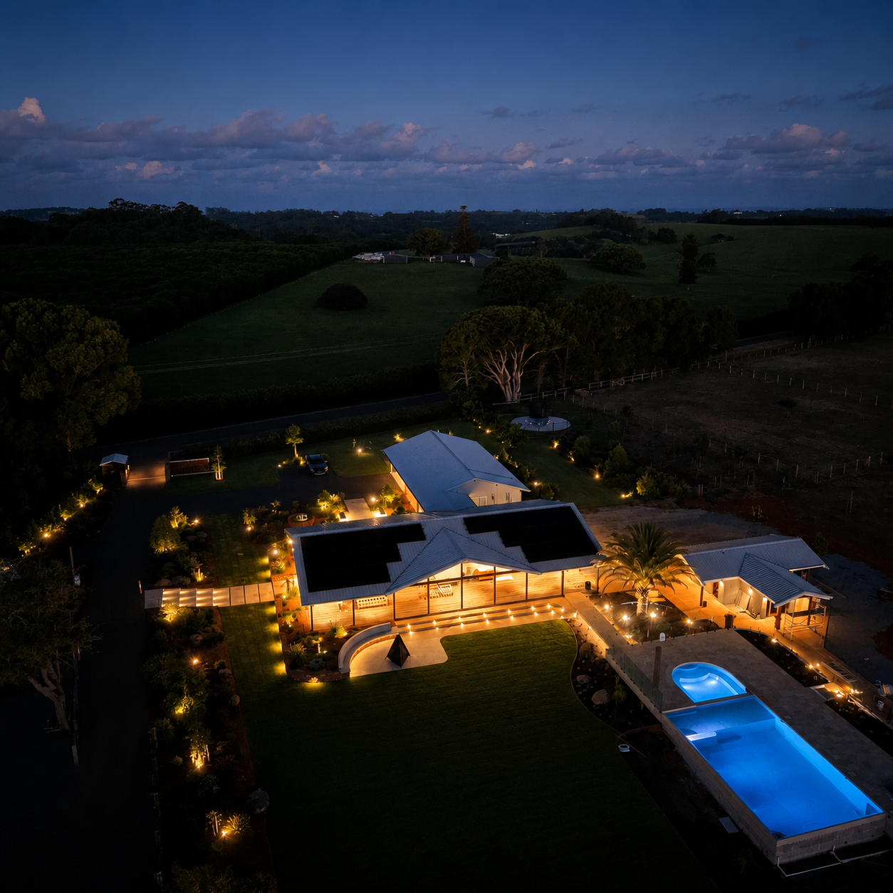 Aerial dusk view of a Northern Rivers property with rooftop solar installed by HJP